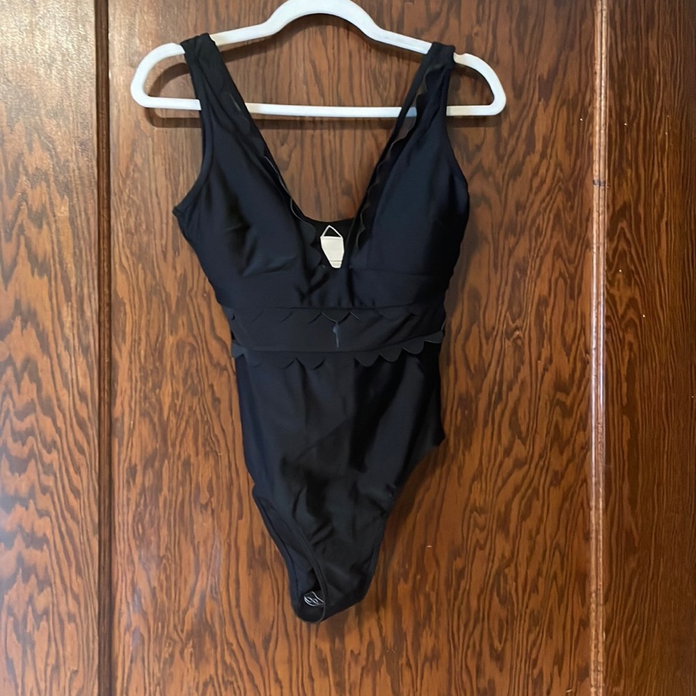 Never worn swimsuit straps were altered